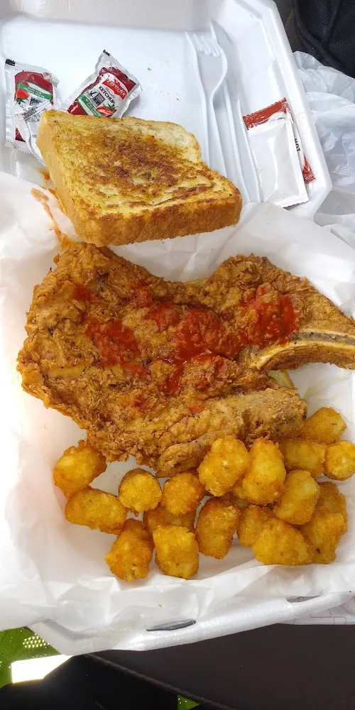 Pork Chops with Tots Topped Off with Hot Sauce